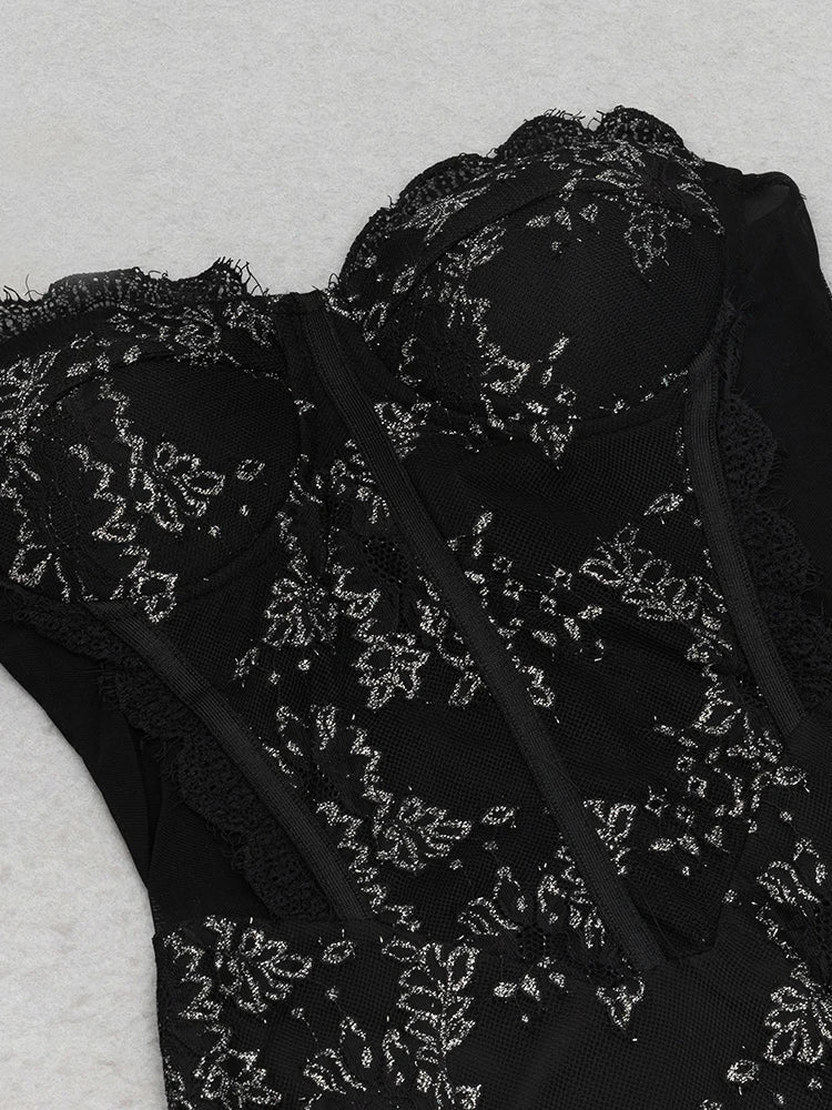 Black lace garment on a light gray background