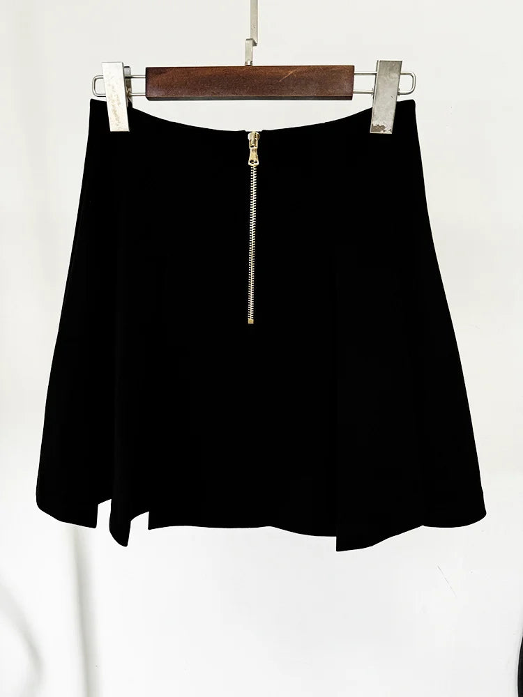 Black pleated mini skirt with gold zipper back detail