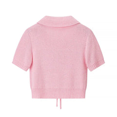 Pink knitted cardigan on a white background