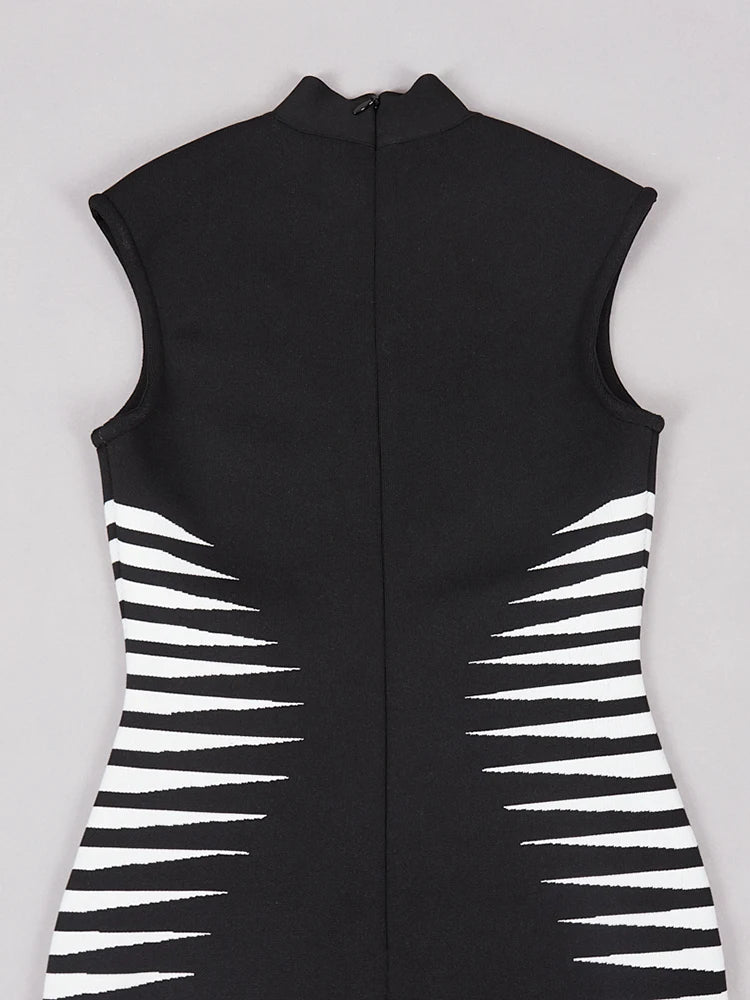 Black sleeveless garment with white geometric patterns on a light gray background