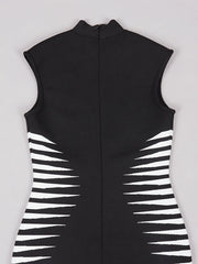 Black sleeveless garment with white geometric patterns on a light gray background