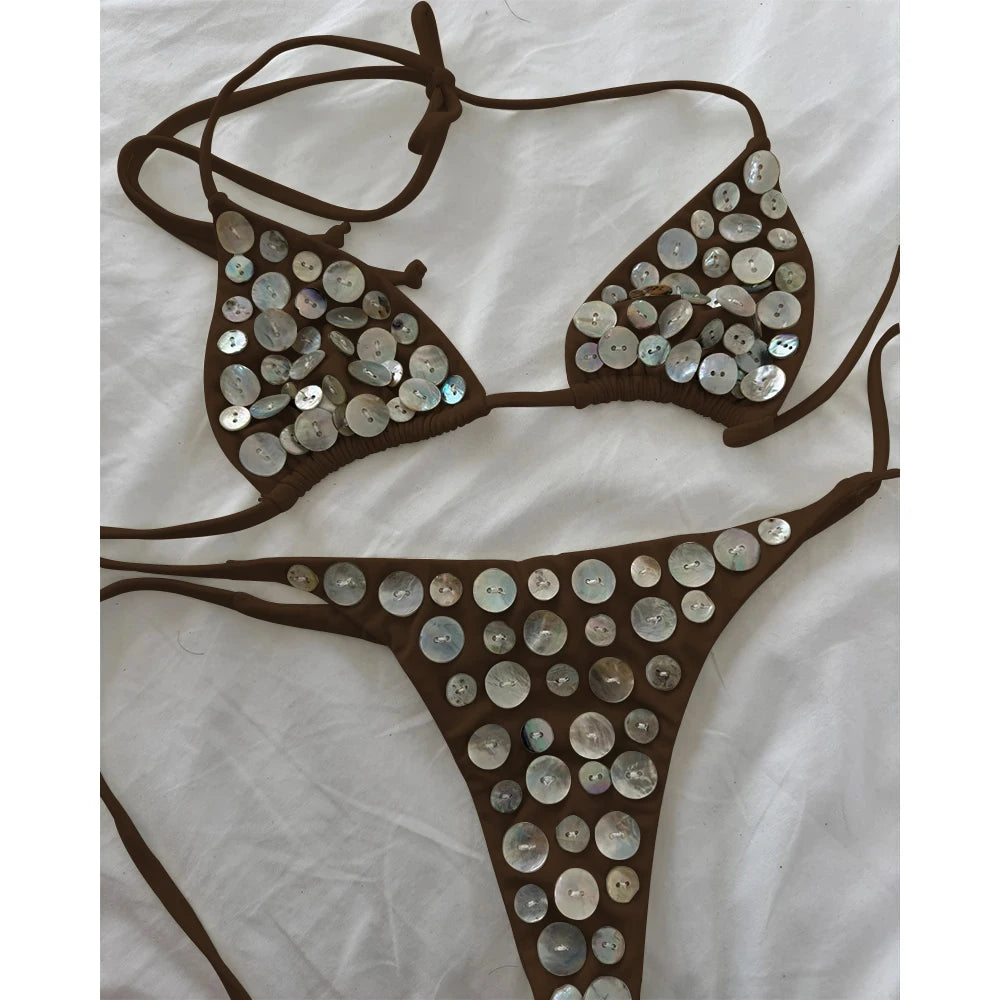 Brown bikini set with circular iridescent button embellishments.