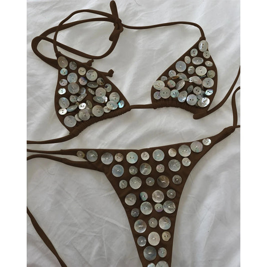 Brown bikini set with circular iridescent button embellishments.