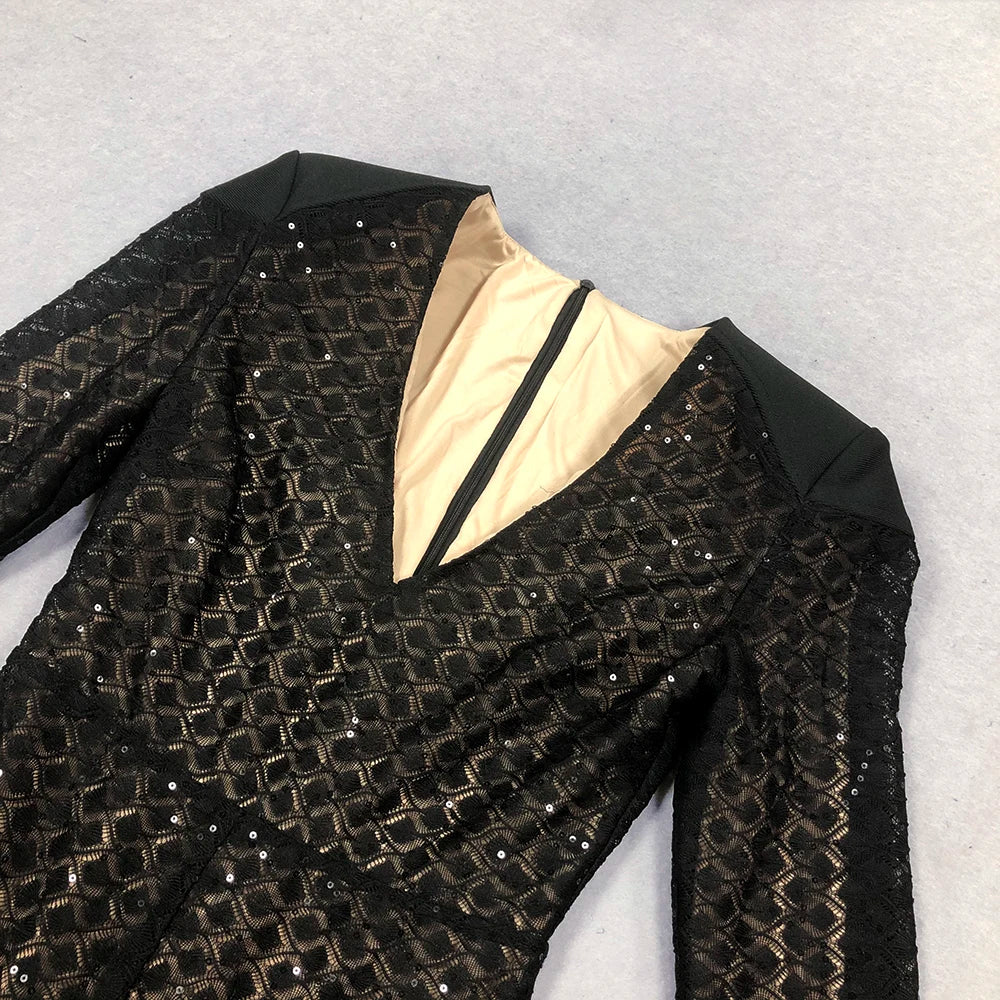 Black sequined jacket with beige lining on a light gray background