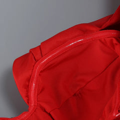 Close-up of a red garment with a gray background