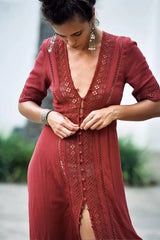 Midi dress with lace trim and V-neck, shown being buttoned.