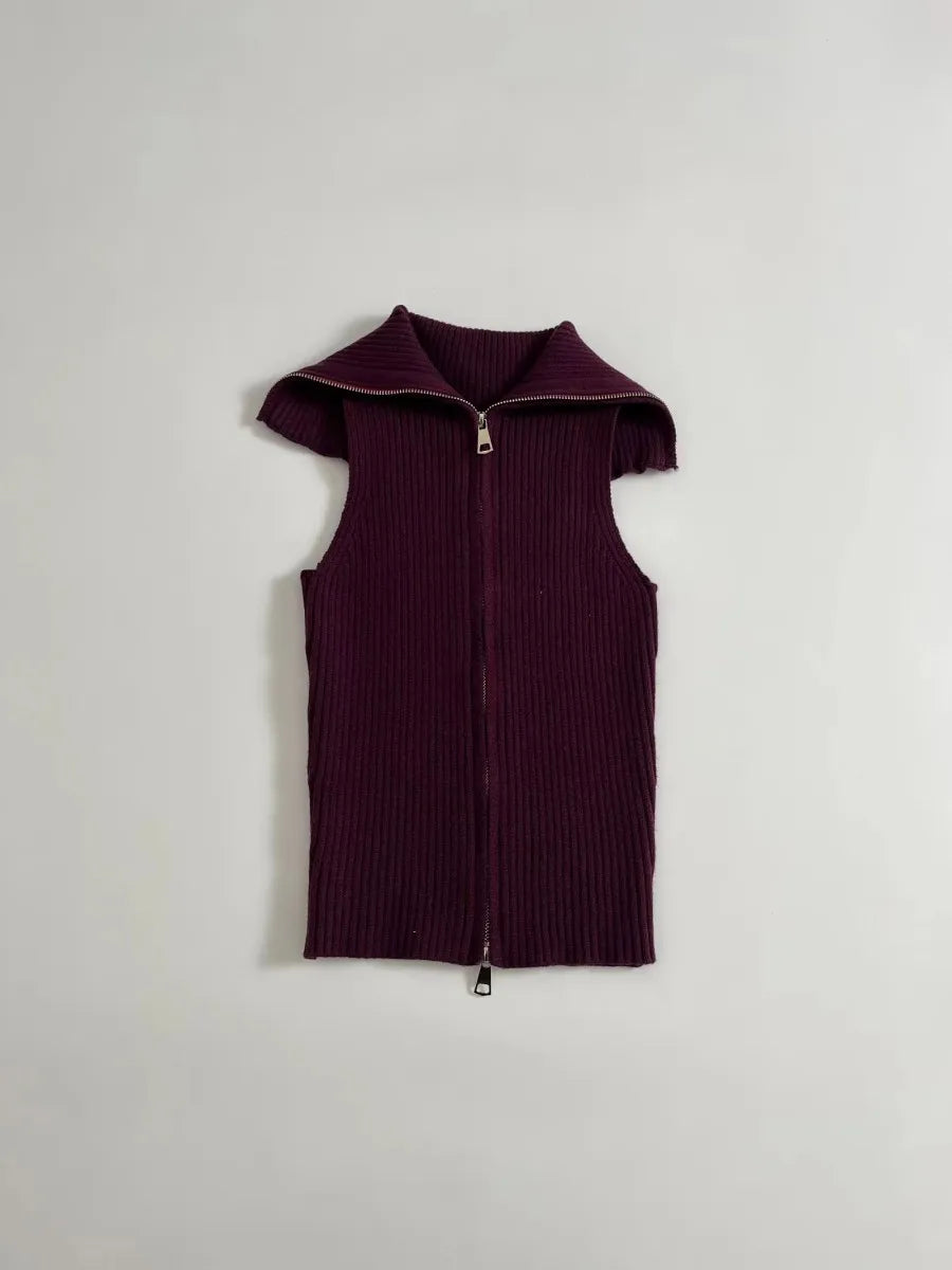Purple ribbed sleeveless zip-up garment on a light gray background