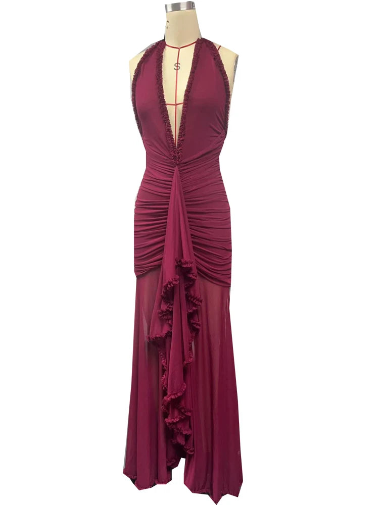 Maroon evening gown on a mannequin against a white background