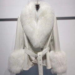 White coat with fur trim on a mannequin against a plain background