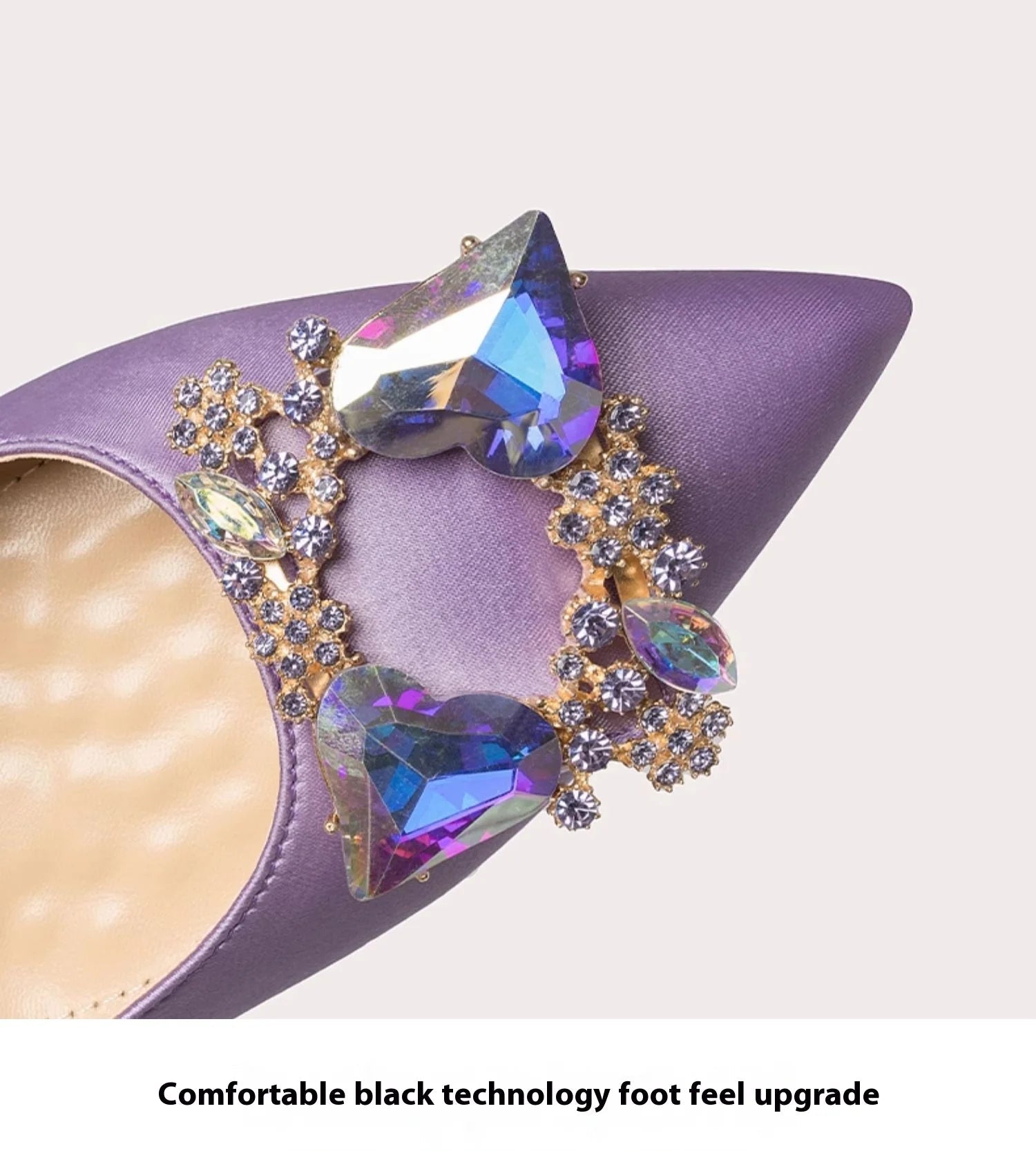 Purple high-heeled shoe with gemstone embellishments on a light gray background