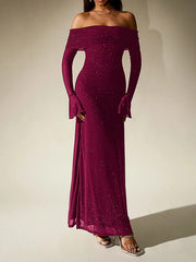Magenta off-shoulder gown with long sleeves on a neutral background