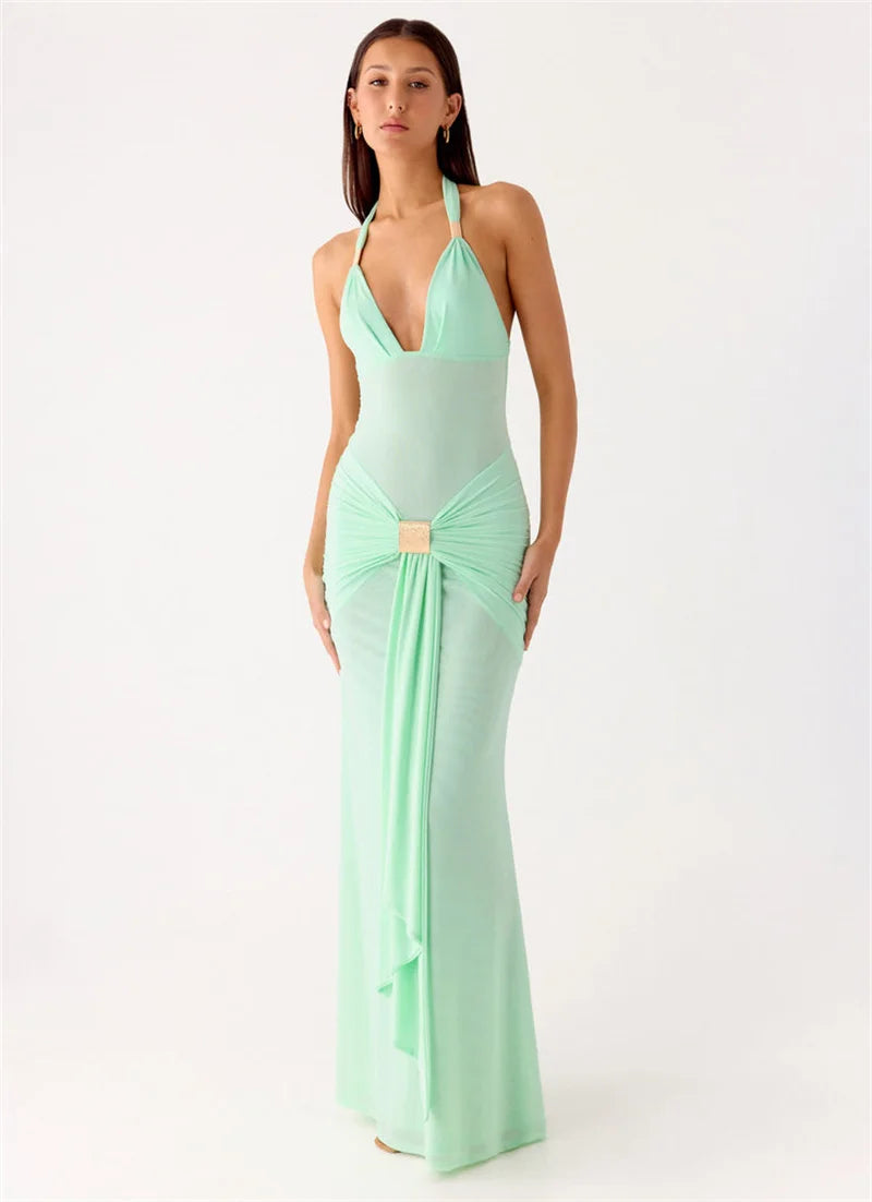 Woman wearing a mint green evening gown on a white background