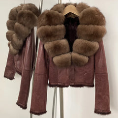 Brown leather jacket with fur trim on a white background