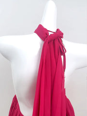 Mannequin wearing a pink halter top with a white background