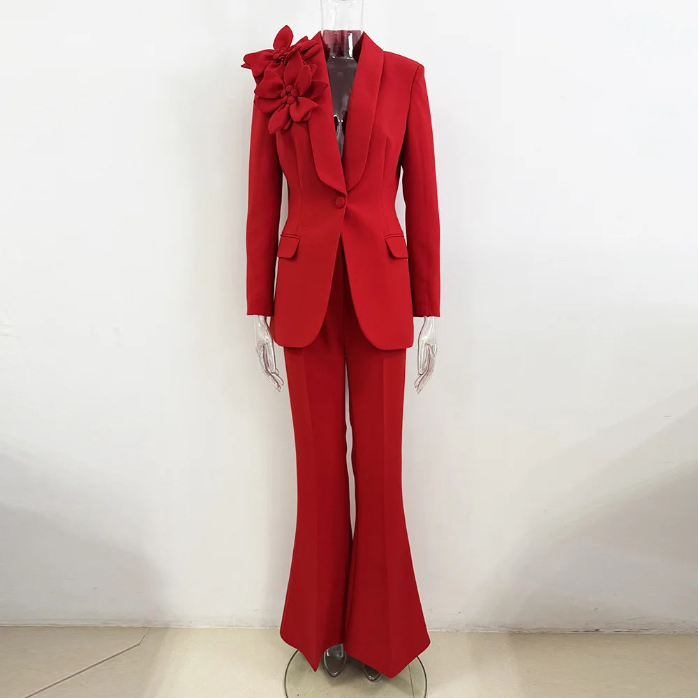 Mannequin wearing red suit jacket with floral detail and flared trousers