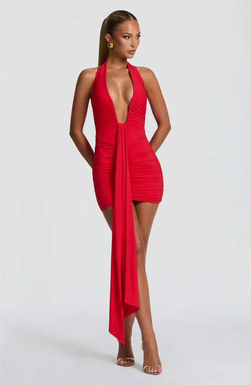 Red halter neck dress with a deep neckline on a white background
