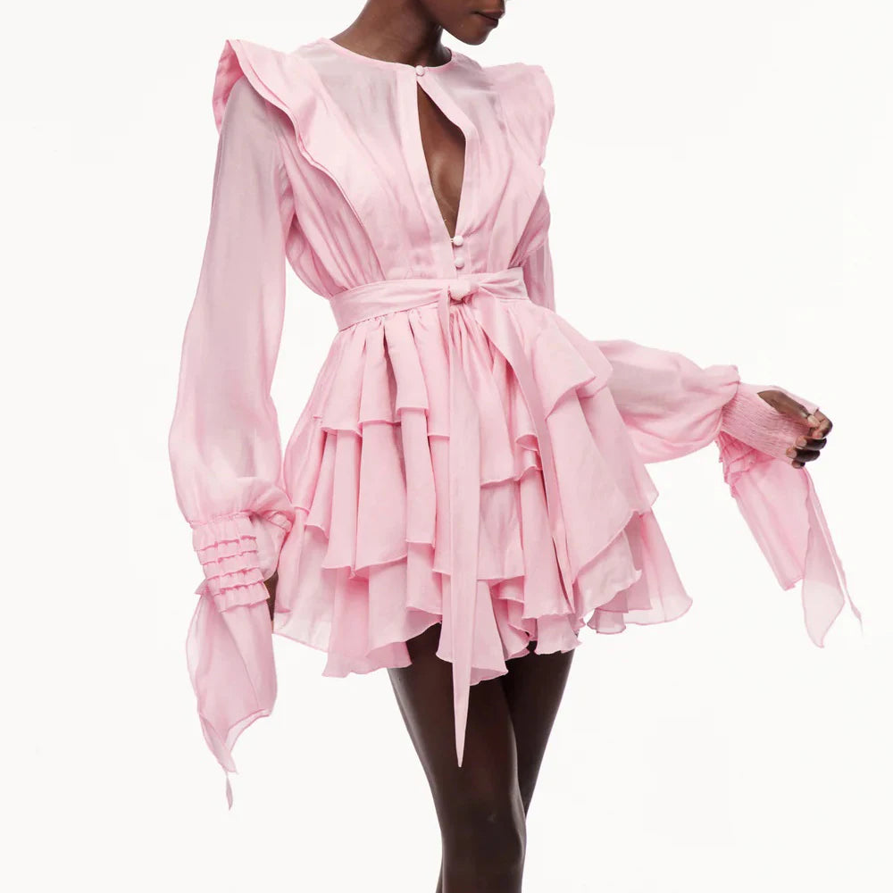 Pink ruffled dress on a white background