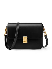 Black handbag with gold accents on a white background