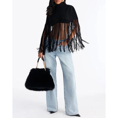 Black knit poncho with turtleneck and fringe hem