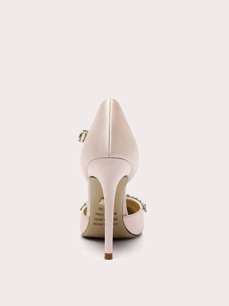 White high-heeled shoe with a gold buckle on a white background