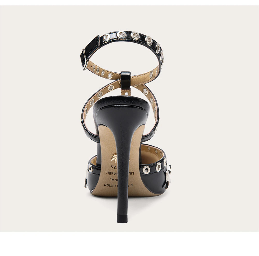 Black high-heeled sandal with studded details on a white background