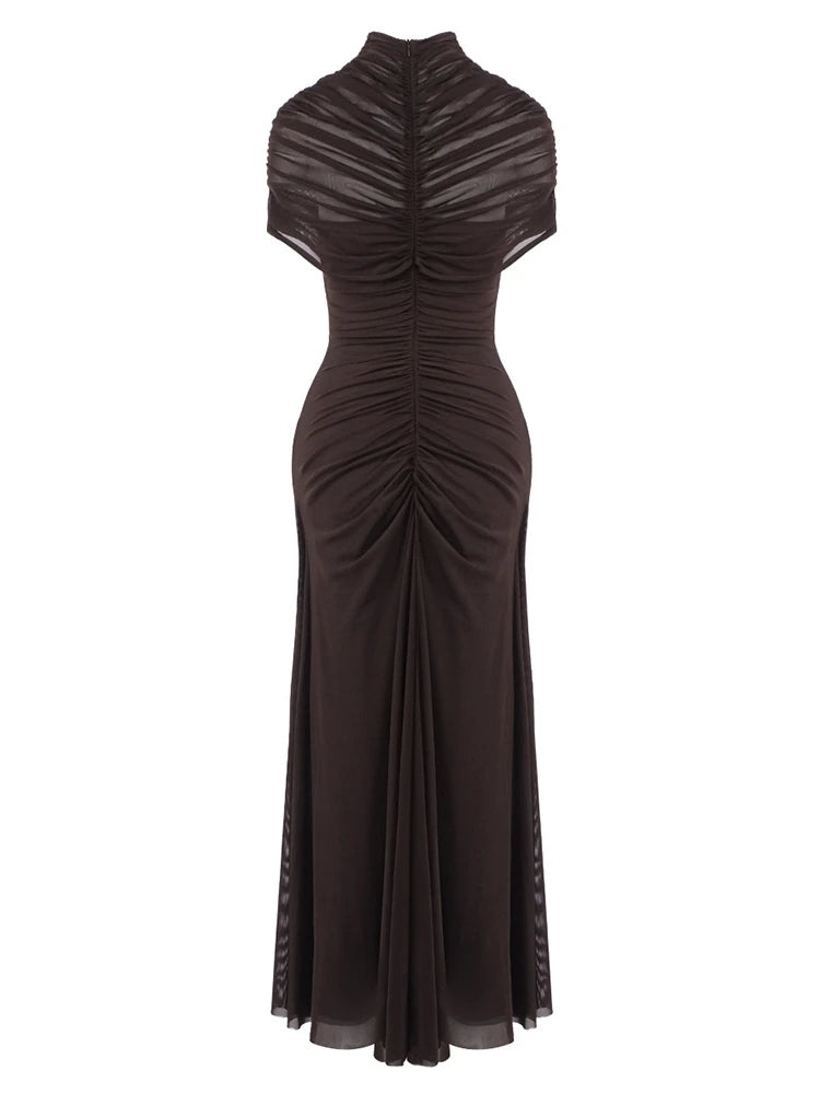 Black evening gown with sheer shoulder panels on a white background