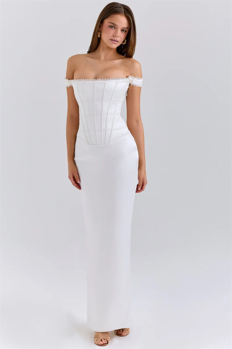 Woman wearing a white off-shoulder dress on a white background