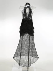 Black lace dress on a mannequin against a white background