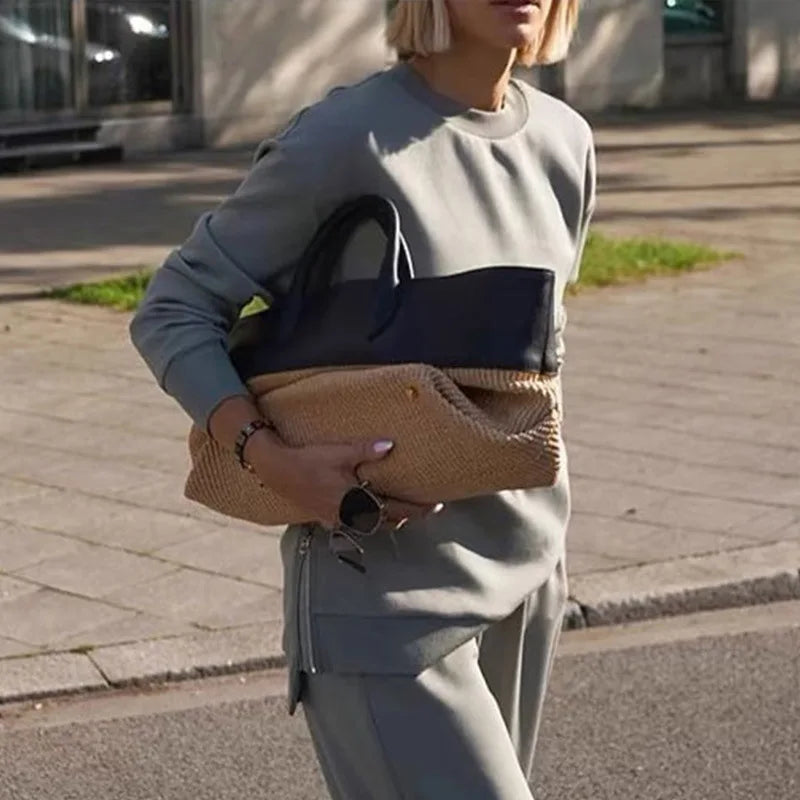 A colorblock tote bag with leather handles