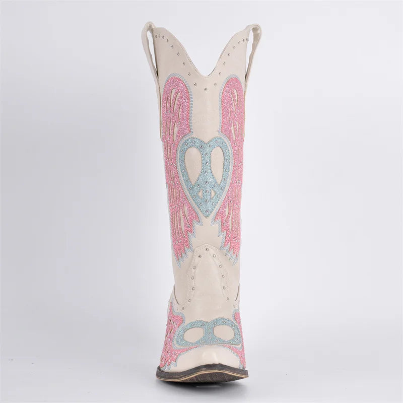 White cowboy boot with pink angel wings and blue heart design on a white background