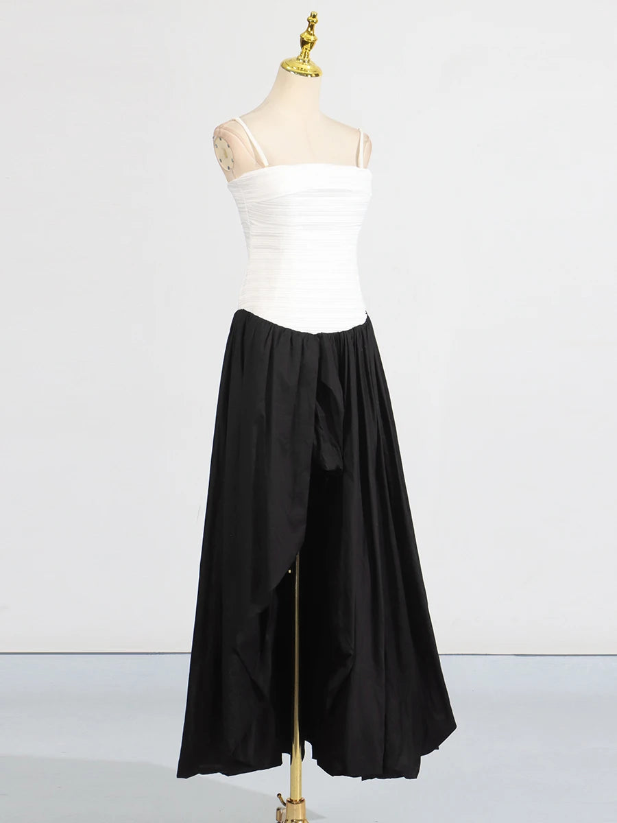 Mannequin wearing a white top and black skirt on a white background
