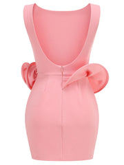 Pink dress with a large bow on a white background