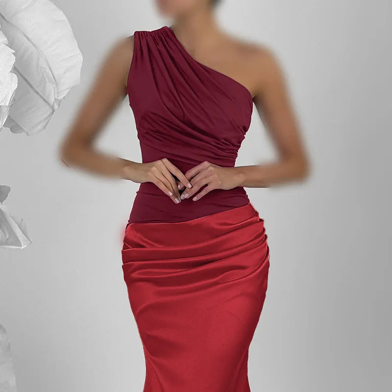 Red one-shoulder dress on a plain background