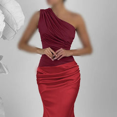 Red one-shoulder dress on a plain background