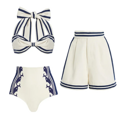 Striped halter bow bikini top and high-waisted shorts set laid flat