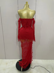 Red lace dress on a mannequin against a white wall