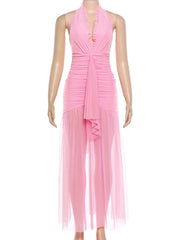 Mannequin wearing a pink halter neck dress on a white background