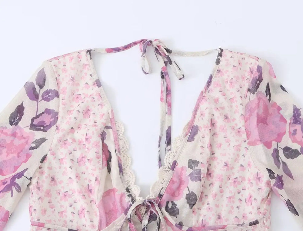 Detail of the V-neck and tie on the floral print mesh dress