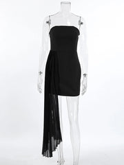 Black strapless dress with sheer overlay on a mannequin against a white background