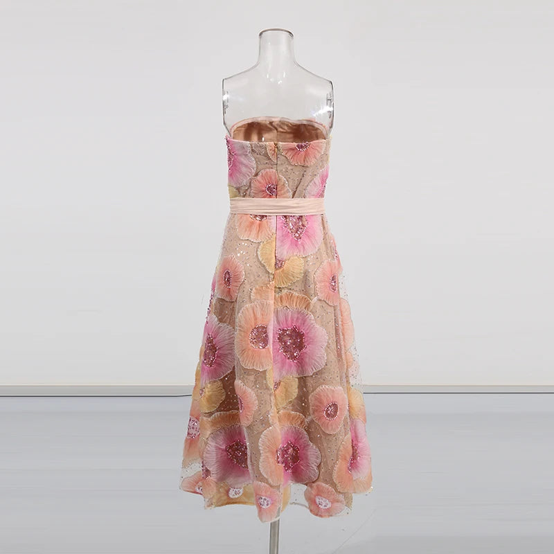 Floral dress on a mannequin against a white background