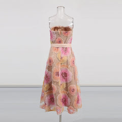 Floral dress on a mannequin against a white background