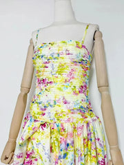 Mannequin wearing a colorful floral dress
