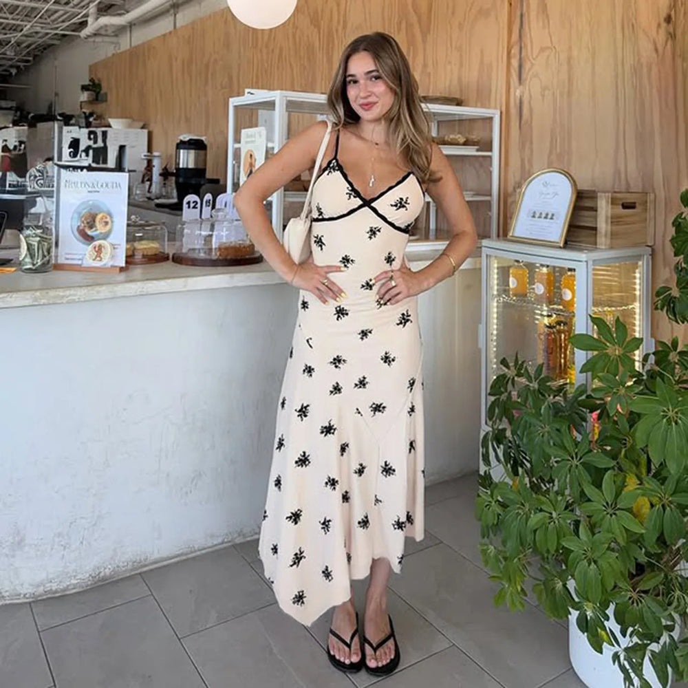 Woman in a floral dress standing in a cafe