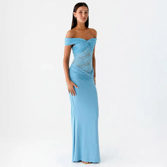 Woman wearing a light blue off-shoulder gown on a white background