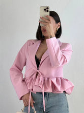 Cropped blazer with ruffled hem and lace-up waist detail