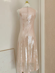 Pink sequin dress on a mannequin against a neutral wall.