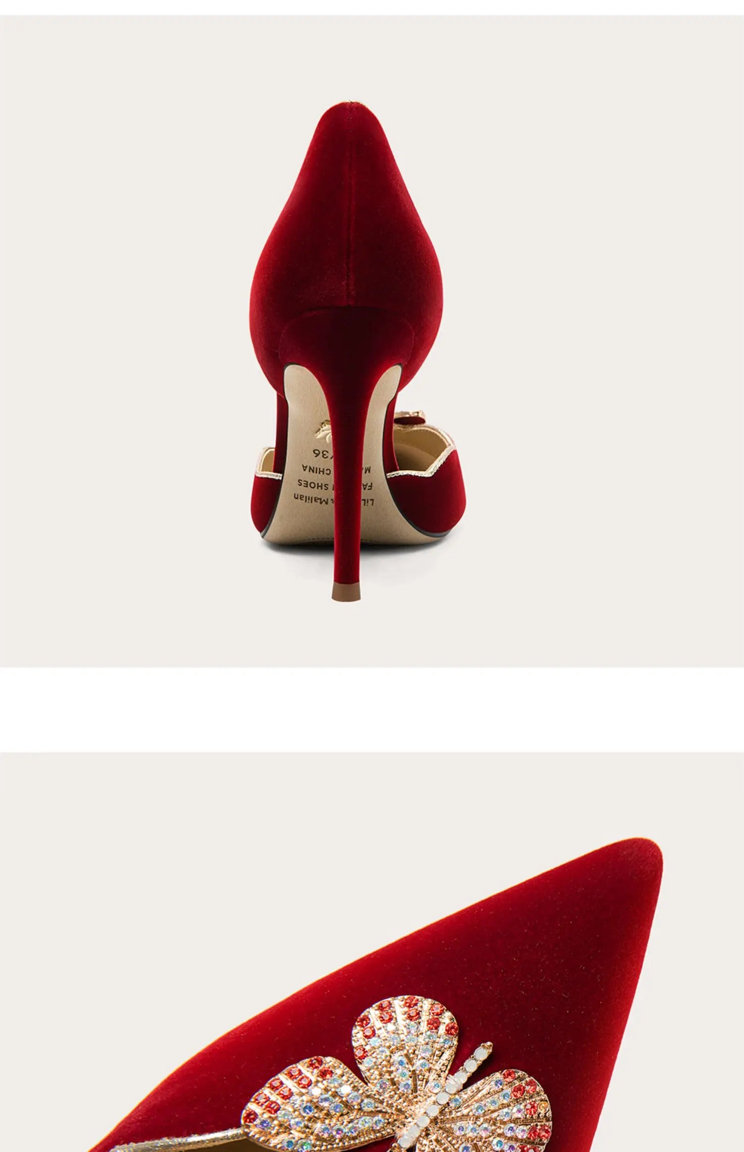 Red high-heeled shoes with a decorative brooch on a white background