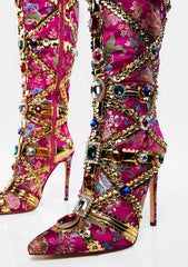 Decorative pink boots with floral patterns and gold embellishments