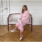 V-neck jacket and midi skirt with ruffled hem.