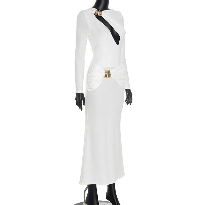 White dress with black accents on a mannequin against a white background